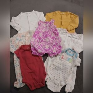 Assorted Newborn Onesies and Romper Lot Of 9.